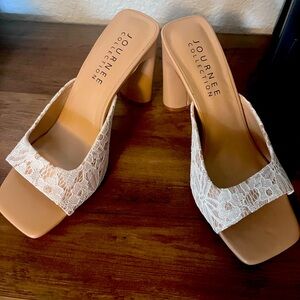 Journey slipper heels that are neutral in color.